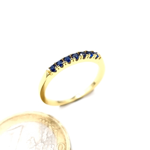 675 - A gold tone silver Gilt  blue gem stone ring, size L, weight 1.32 grams.