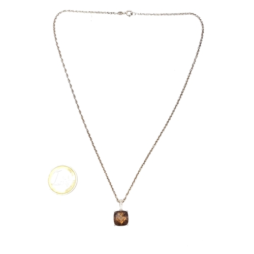 689 - A vintage smoky quartz pendant set with a sterling silver chain, length 44cm.