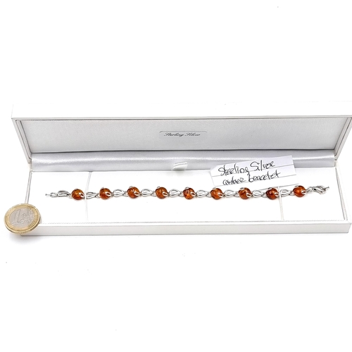 692 - An attractive example of an amber stone bracelet set in sterling silver.