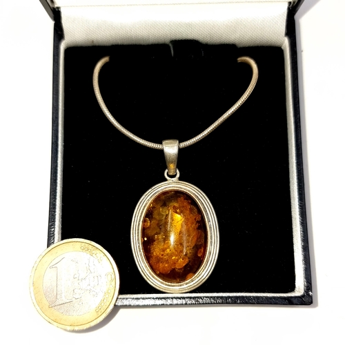 703 - A baltic amber pendant necklace with a sterling silver chain, length 40cm, boxed.