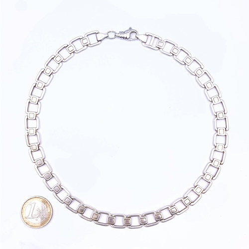 706 - A sterling silver square link necklace, length 46cm, weight 56.96 grams.