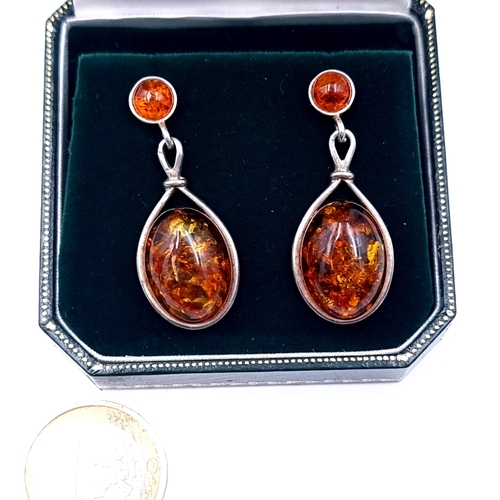 707 - A pair of sterling silver and amber  earrings length 3.5cm, weight 6.52 grams, boxed. Lovely colour ... 