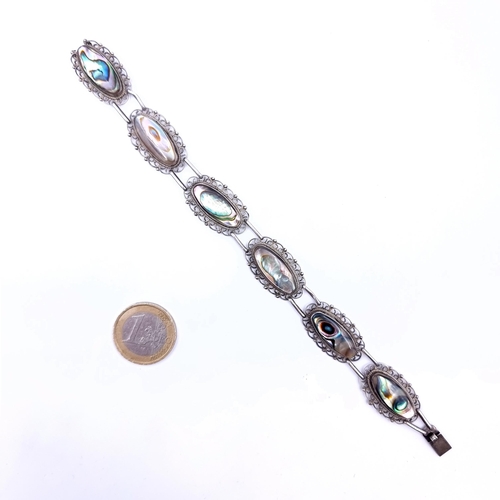 711 - A vintage sterling silver six stone abaloney bracelet, weight 17.85 grams. Very pretty piece.