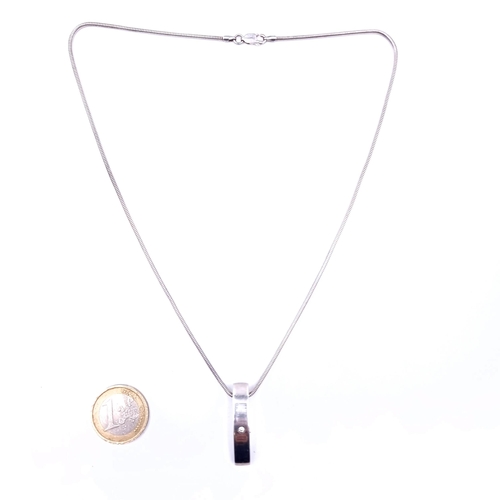 A sterling silver gem set pendant and chain, length of chain 44cm, total weight 8.5 grams.