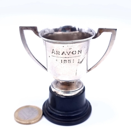 722 - A small sterling silver presentation cup hallmarked Sheffield with inscription to reverse mounted on... 