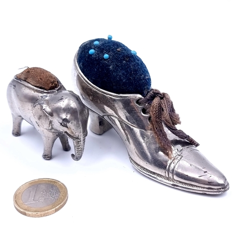 723 - Two antique silver plated pin cushions in the form of a ladies shoe and elephant, shoe 9cmx5cm and e... 