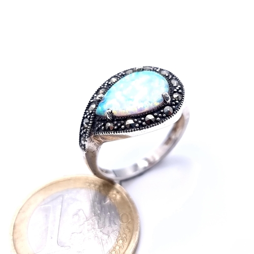 741 - A pretty art deco Opal tear drop stone ring set with marcasite surround set in sterling silver, ring... 