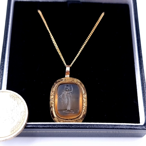 746 - A Victorian citrine intaglio stone mounted in gold together with chain, length 44cm, weight 5.8 gram... 