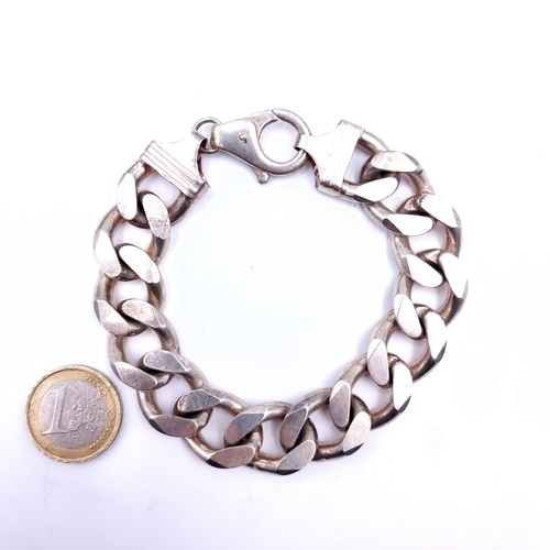 747 - A fine example of a sterling silver heavy chain link bracelet set with lobster clasp, weight an exce... 