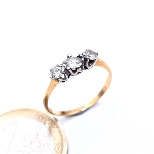 749 - Star Lot : A brilliant cut 3 stone diamond ring with crown setting, estimated weight .4cts, J colour... 