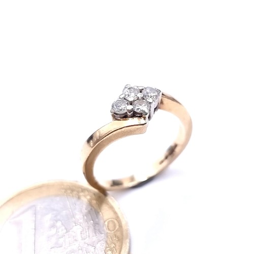 750 - Star Lot : A super pretty 9K gold brilliant cut four stone crossover ring, diamond weight .25cts, st... 