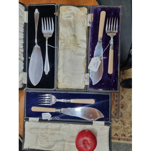 784 - Three antique silver plated fish server sets all with original cases including a 1923 Sheffield exam... 