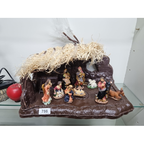 786 - A beautiful nativity scene. Including mounted figures and crib.