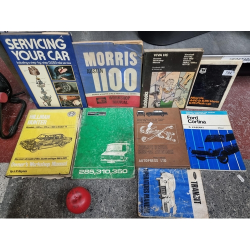 A collection of 9 classic car enthusiasts servicing manuals for cars