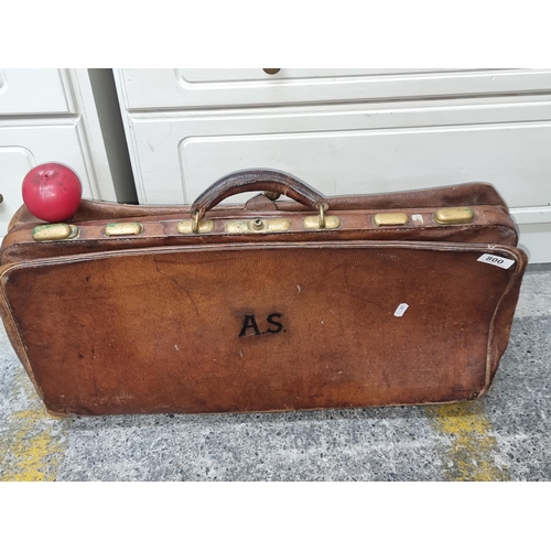 800 - A 1930's leather suitcase with brass hardware. Features the initials A.S. to side.