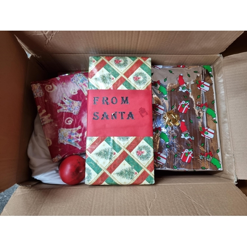 808 - Two boxes filled with Christmas decoration items including gel window stickers, faux wrapped present... 