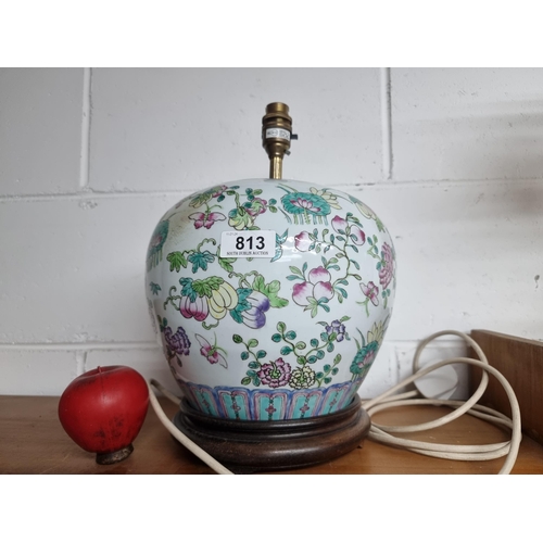 813 - A stunning large Hong Kong made hand painted table lamp boasting rich floral detail throughout.