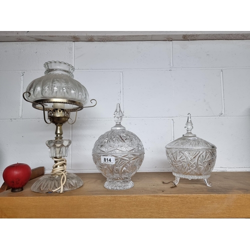 814 - A trio of elegant cut glass items including two large lidded pedestal bowls and aa well as gorgeous ... 