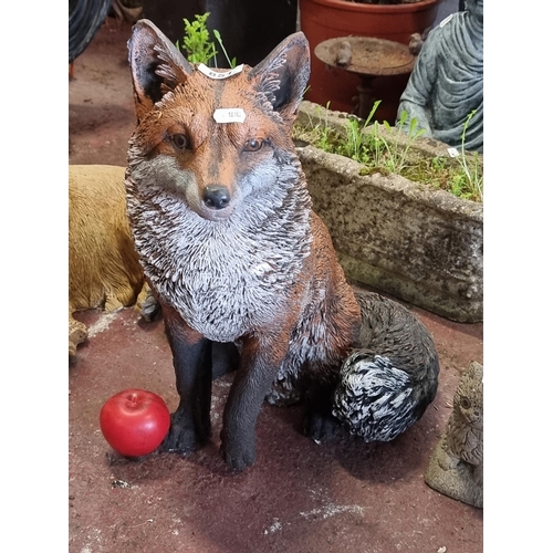 851 - A very sweet and heavy reconstituted stone garden sculpture of a cunning fox, in a bright and realis... 