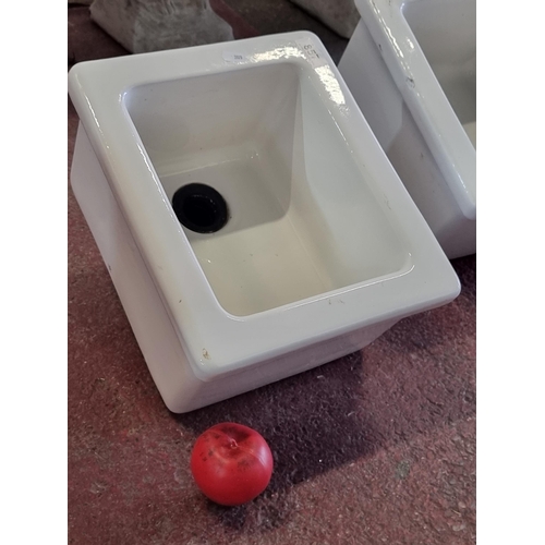 857 - A neatly sized vintage heavy rectangular Belfast sink with drain fitting to base. W33cm x L28cm x D1... 