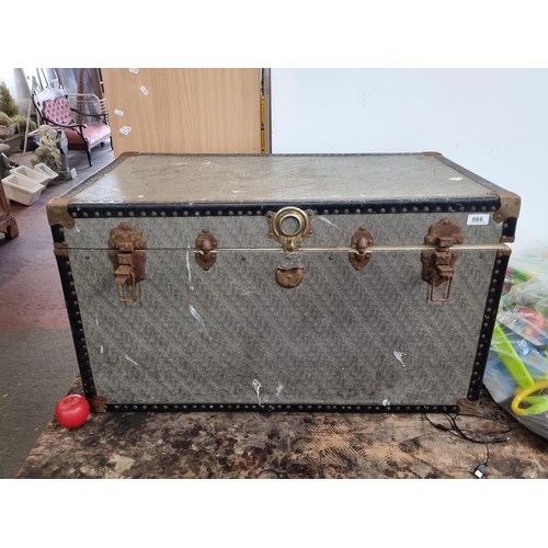 866 - A very large vintage trunk filled with a number of baby car seat covers and other items, all in orig... 