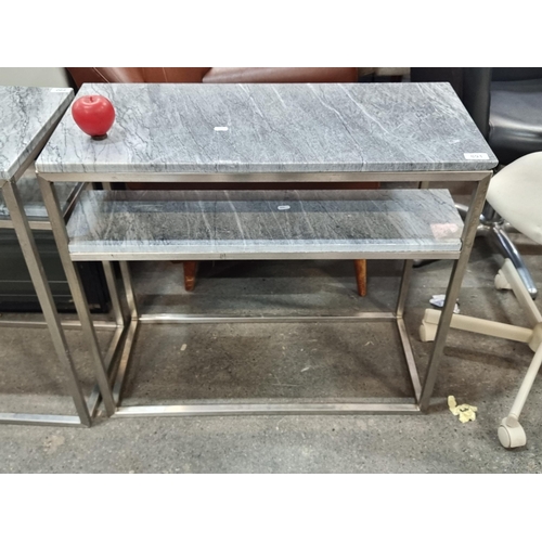 891 - Star lot : A sleek console table with grey marble top and shelf. Ideal for living spaces or commerci... 