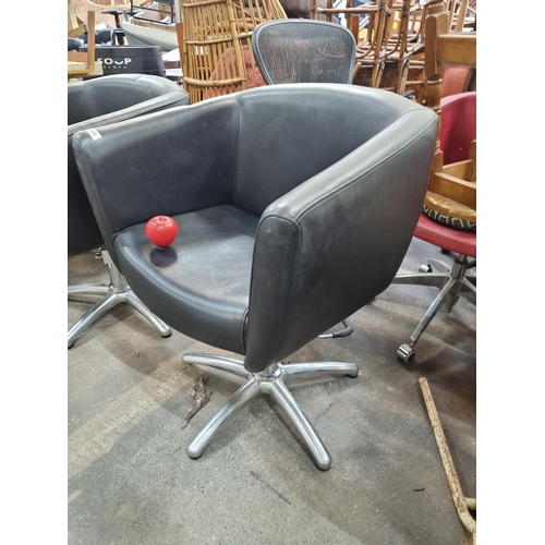 905 - Star lot : A commercial hair salon station hydraulic armchair with adjustable height, upholstered in... 