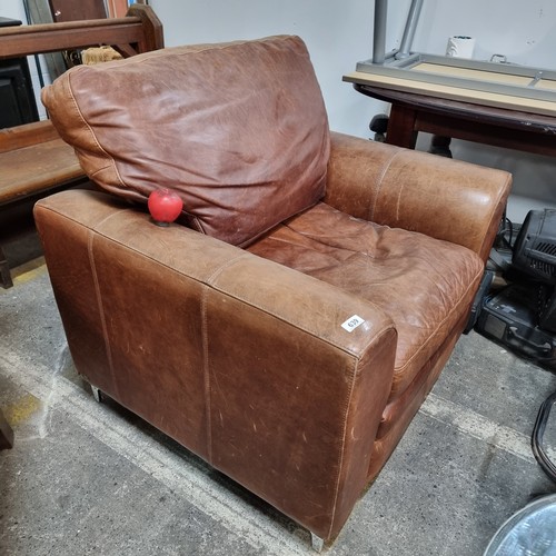 639 - A superb large brown tan leather armchair.