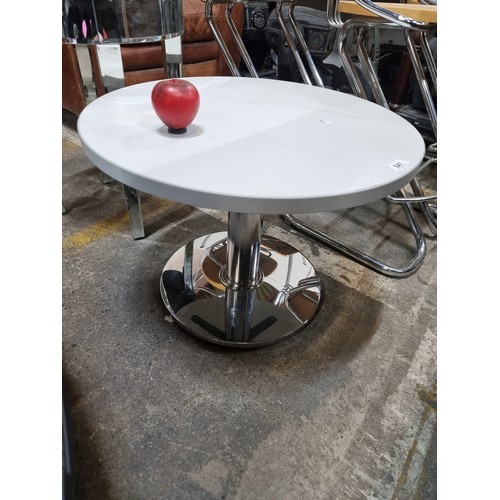 641 - A wonderful contemporary designer circular coffee table set on chrome base. In lovey condition.