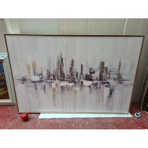 283 - A very large contemporary print depicting a striking abstract image reminiscent of an urban sky line... 