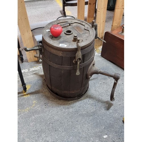 608 - A fabulous antique butter churn barrel with metal hardware.