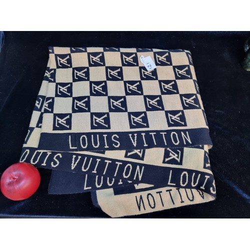 121 - A large  Louis Vuitton scarf featuring a monogram design in beige and black.