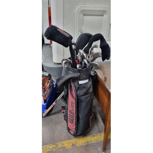 593 - A set of Pro Select NXT golf clubs including irons 3-9. woods, driver and putter. Includes a Wilson ... 