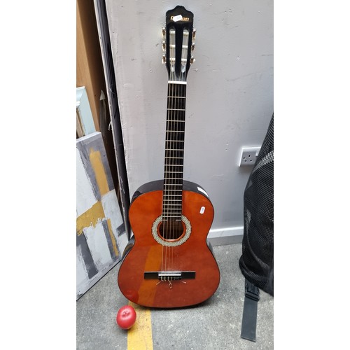 881 - A Clifton concert guitar No. 064877. In a brown and black finish.