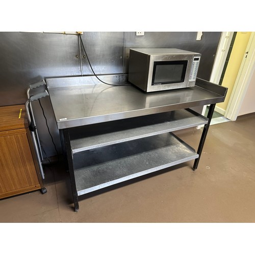 474 - Star Lot : A Commercial Stainless Steel prep table with gallery back and side and storage below. Thi... 