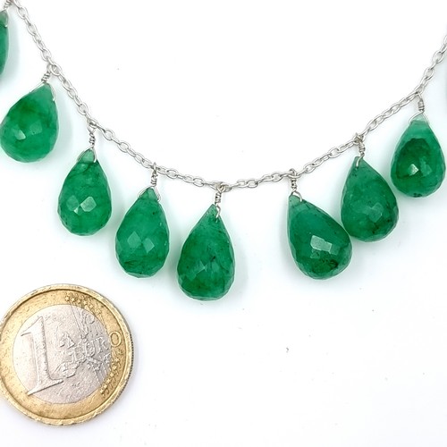 33 - A lovely emerald graduated pendant necklace set with sterling silver chain with an adjustable length... 