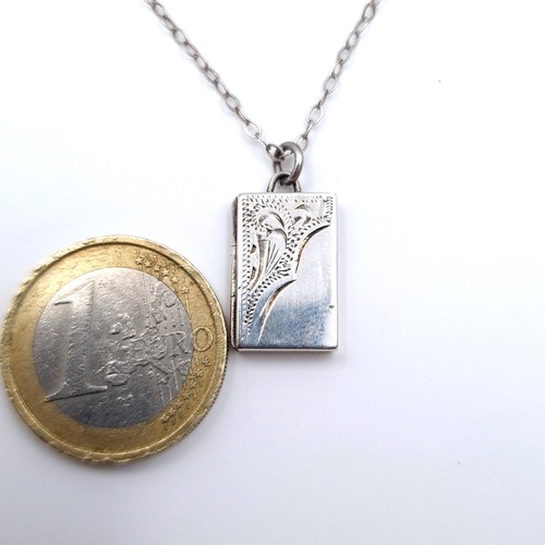 667 - A hallmarked Birmingham sterling silver hinged pendant necklace set with sterling silver chain, leng... 