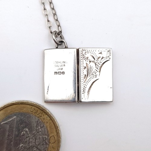 667 - A hallmarked Birmingham sterling silver hinged pendant necklace set with sterling silver chain, leng... 