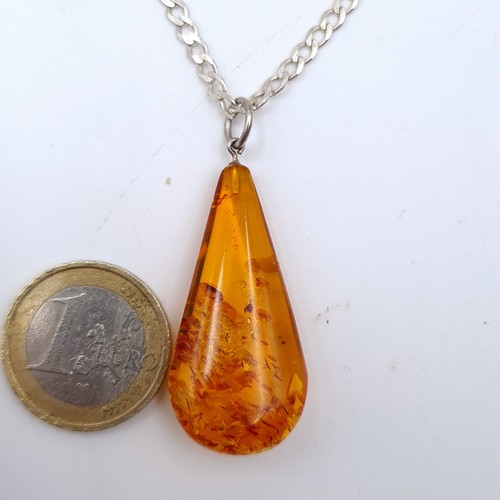 671 - A baltic amber pendant set with a good quality silver chain with lobster clasp, pendant 4cmx2.5cm, l... 