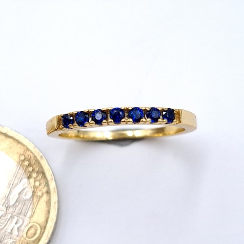 675 - A gold tone silver Gilt  blue gem stone ring, size L, weight 1.32 grams.