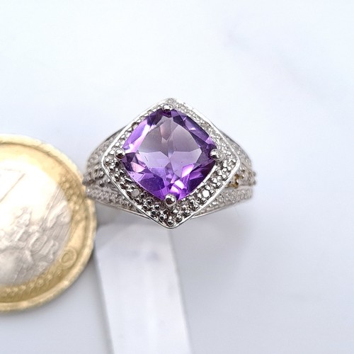 678 - A fine example of an amethyst gemstone gem set ring set in sterling silver, size O, weight 5.36 gram... 