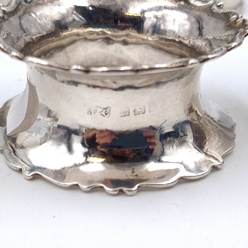 685 - A collection of five assorted napkin rings including four silver examples, total weight of silver 34... 