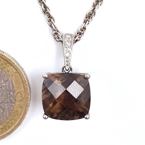 689 - A vintage smoky quartz pendant set with a sterling silver chain, length 44cm.