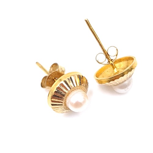 695 - A pair of 9K gold pearl stud earrings, total weight 1.38 grams, boxed.