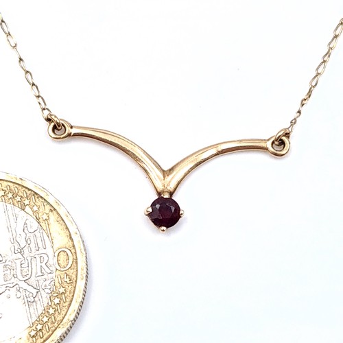 704 - Star Lot : A very pretty 9k gold garnet set pendant necklace, length of chain 46cm.