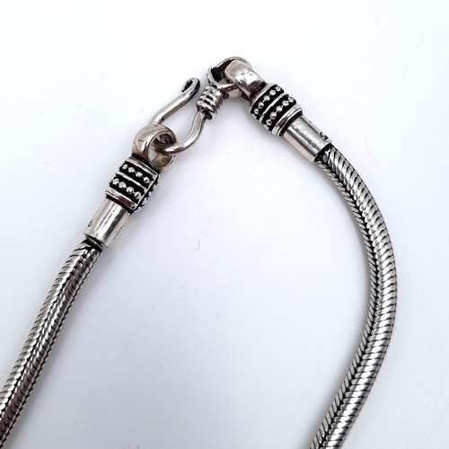 713 - Two sterling silver cable link necklaces, the first with cabochon stone pendant, length of necklace ... 