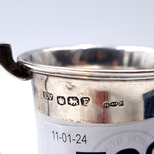 722 - A small sterling silver presentation cup hallmarked Sheffield with inscription to reverse mounted on... 