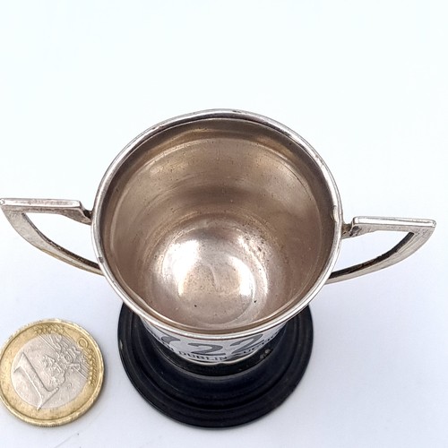 722 - A small sterling silver presentation cup hallmarked Sheffield with inscription to reverse mounted on... 