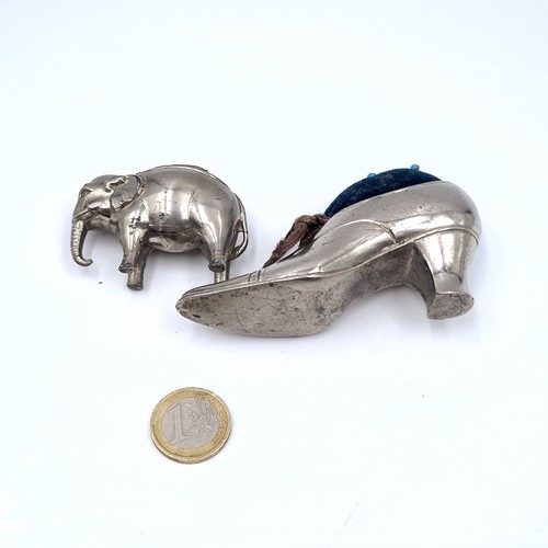 723 - Two antique silver plated pin cushions in the form of a ladies shoe and elephant, shoe 9cmx5cm and e... 