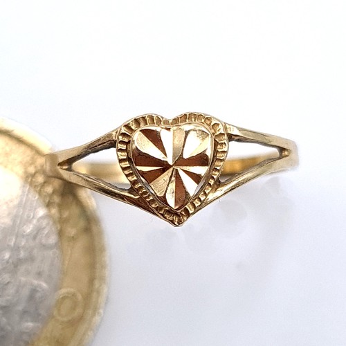 729 - A 14K gold heart shaped diamond ring, ring size J, weight 1.21 grams.